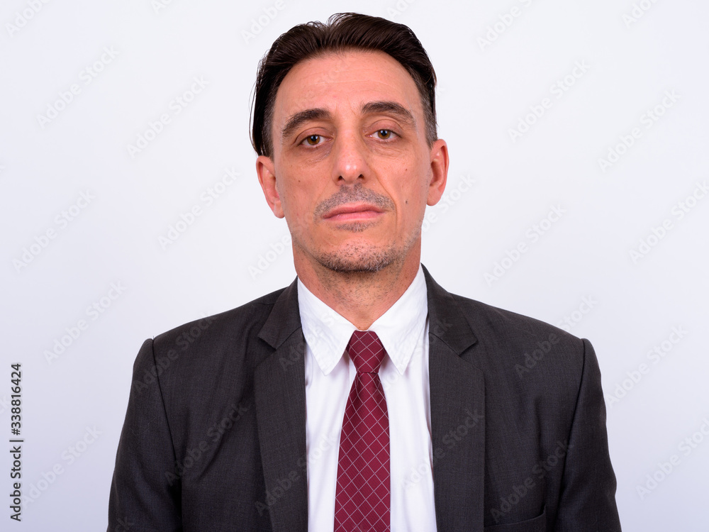 Mature handsome Italian businessman against white background Mature handsome Italian businessman against white background