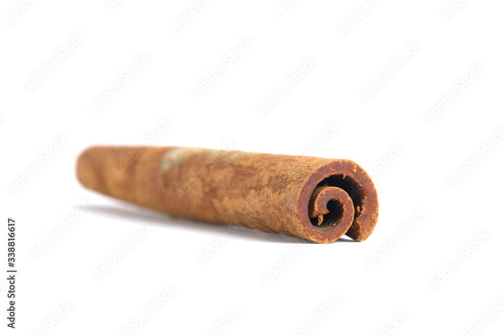 Closeup dried cinnamon stick isolated on a white background Closeup dried cinnamon stick isolated on a white background