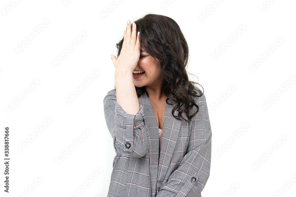 girl in a classic checkered gray jacket feels uncomfortable on a white background girl in a classic checkered gray jacket feels uncomfortable on a white background