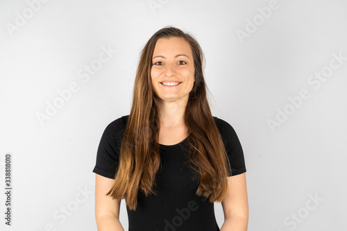 Young woman smiling in black shirt with long hair