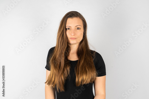 Young woman angry in black shirt with long hair
