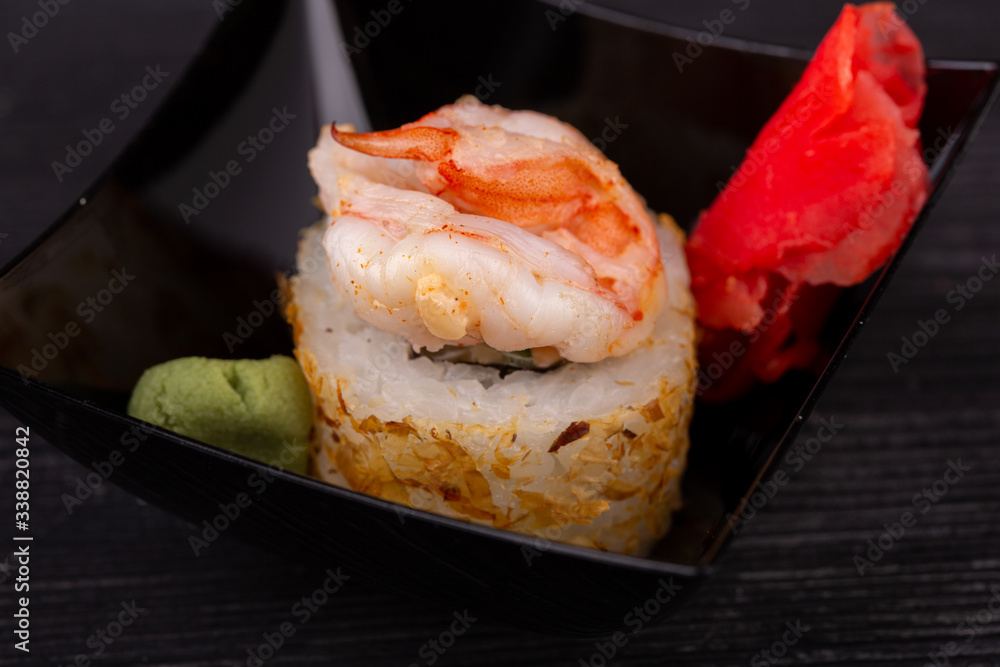 Assorty of sushi and roll, serve with red ginger and wasabi sauce Assorty of sushi and roll, serve with red ginger and wasabi sauce