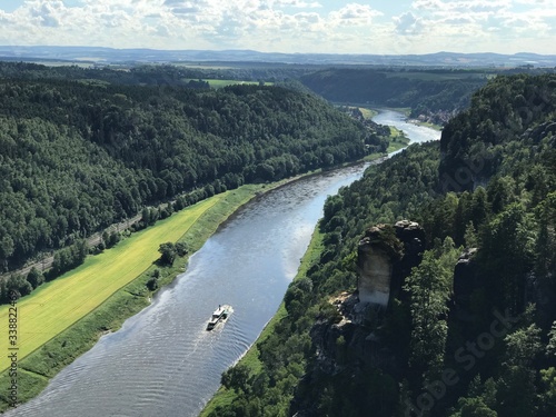 Amazing nature in the Saxon Switzerland, Dresden, Germany shown in a panorama with huge river and green landscape