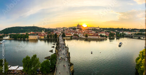 Amazing panoramic and romantic sunset view in Prague showing the Charles Bridge to Prague Castle with beautiful blue and red mix