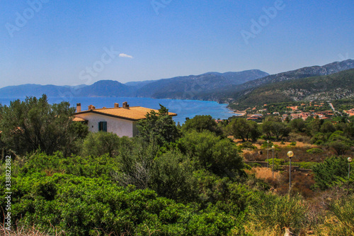 House on a hill over the sea and village at the coast of the Mediterranean Sea