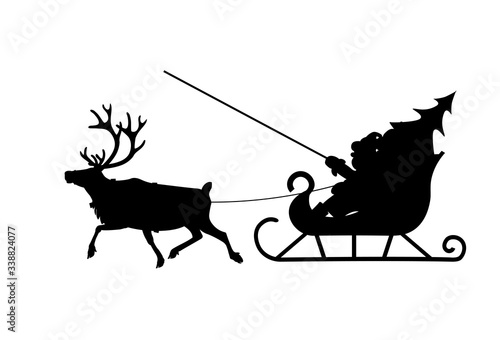 Silhouette of Santa Claus in his christmas sled pulled by reindeer