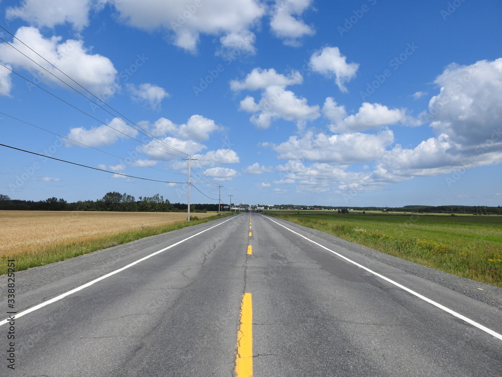 A paved road under a blue sky