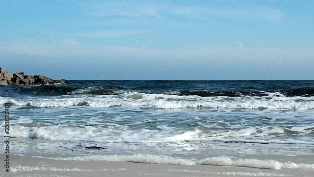 Baltic Sea Beach, Water and Waves - Ground View - Tracking Shot Baltic Sea Beach, Water and Waves - Ground View - Tracking Shot