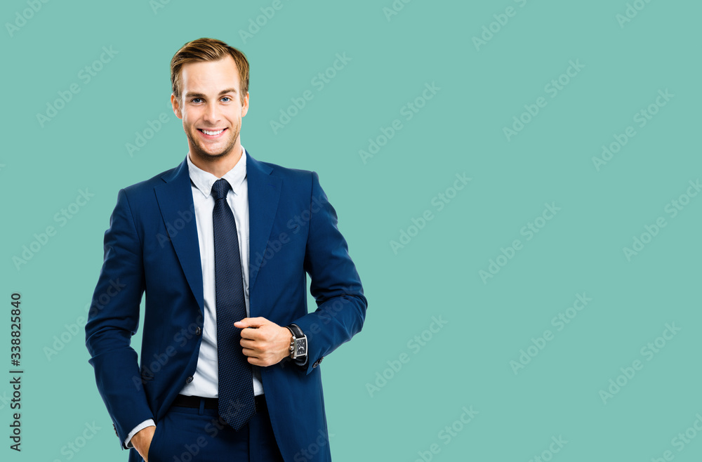 Portrait of happy confident businessman in blue suit and tie, isolated over green marine color background. Business success concept. Smiling man at studio picture. Copy space for some text or slogan. - obrazy, fototapety, plakaty 