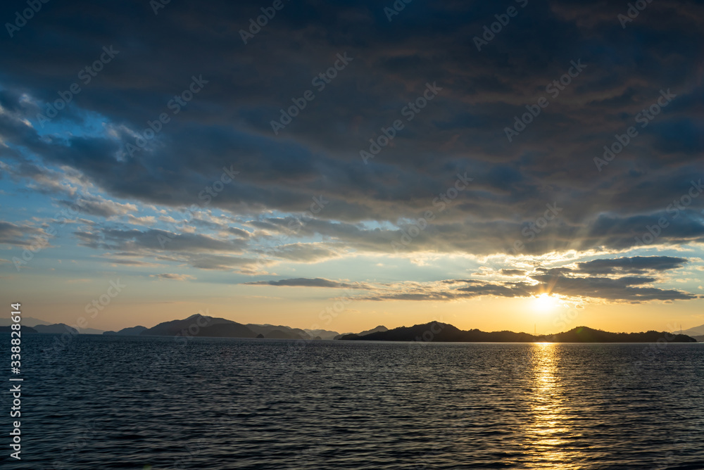 Sunset time in the Seto Inland Sea, Japan. Golden reflection on ocean surface