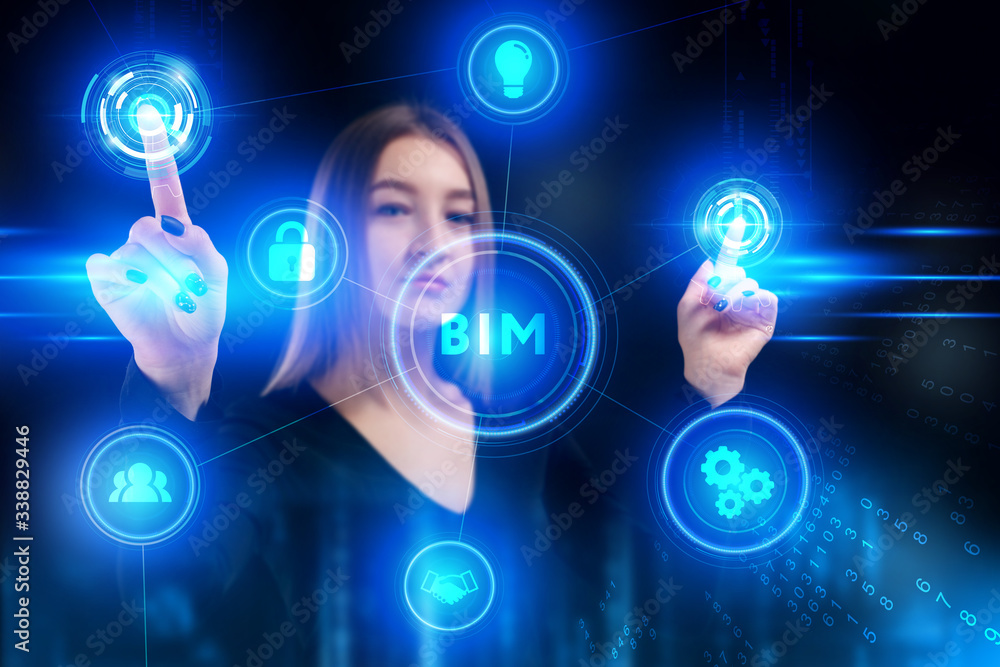 Fototapeta premium Business, Technology, Internet and network concept. Young businessman working on a virtual screen of the future and sees the inscription: BIM