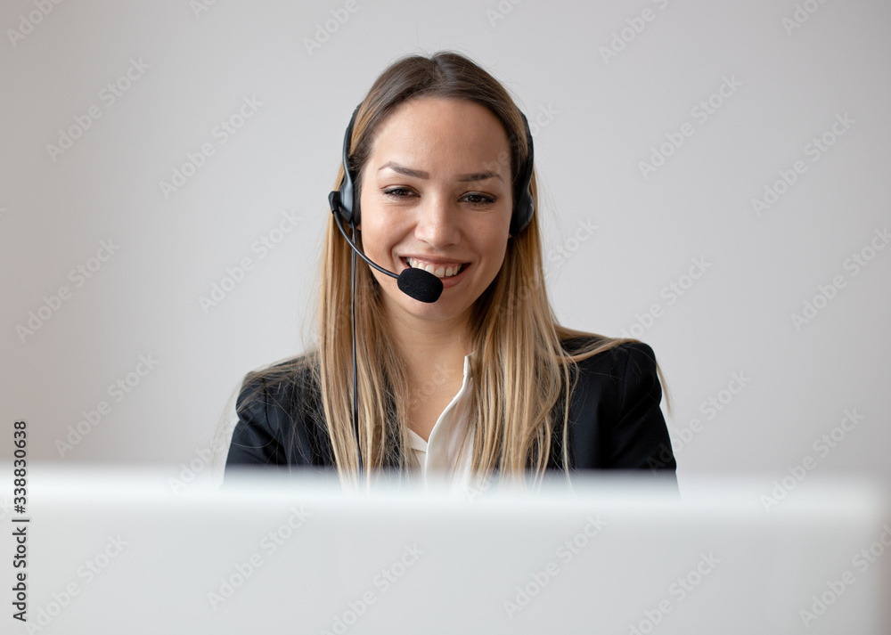 Young woman working in call center. Customer support woman in office Young woman working in call center. Customer support woman in office