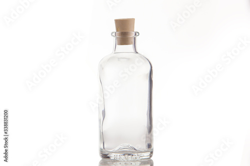 Beautiful transparent bottle with cap isolated on white background