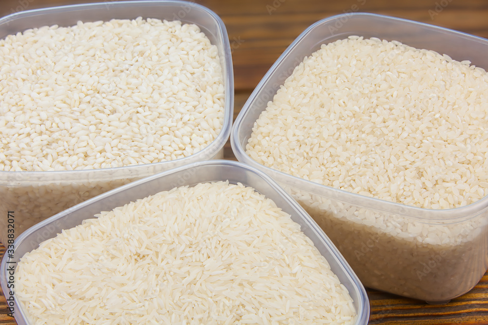 Raw rice groats for risotto on plate Raw rice groats for risotto on plate