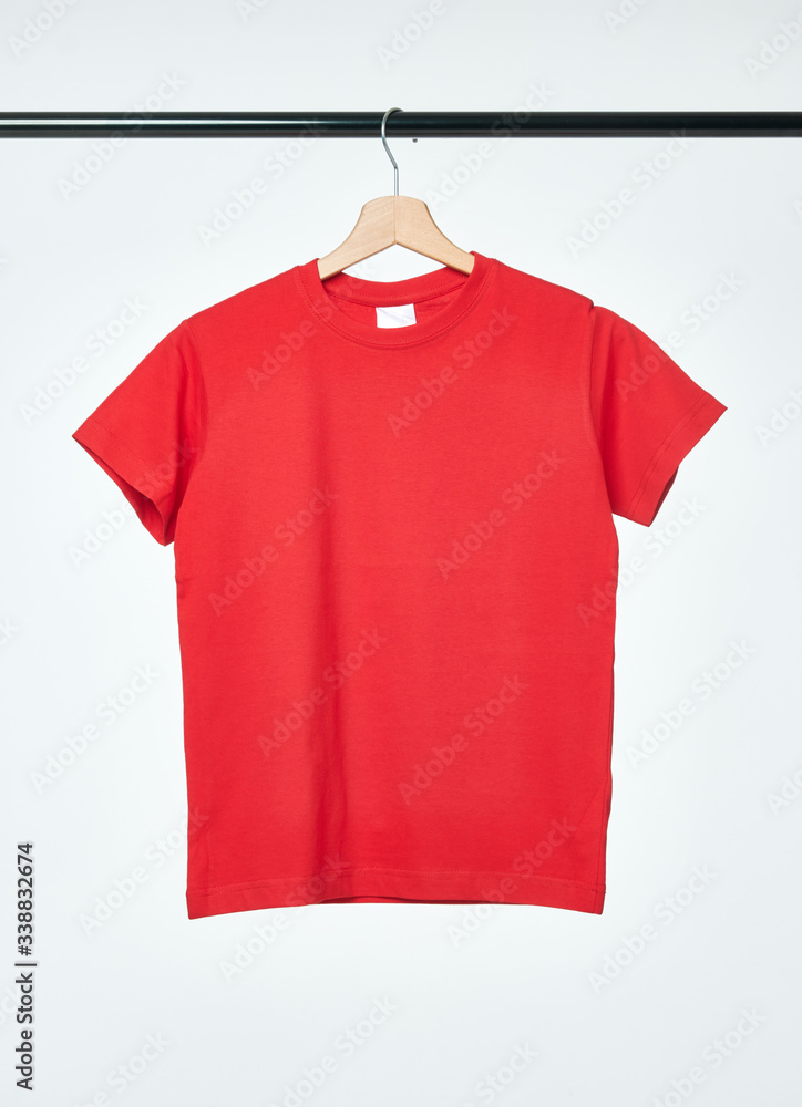 Blank red T-Shirt mock-up hanging on white background. Blank red T-Shirt mock-up hanging on white background.