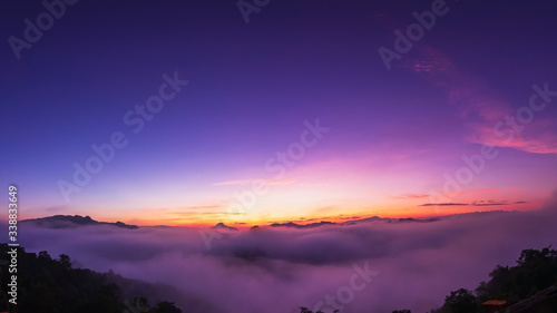 The beautiful early morning sky with twilight and waves of fog of Baan Ja Bo village viewpoint Pang Mapha, Mae Hong Son, Northern Thailand. Panorama view