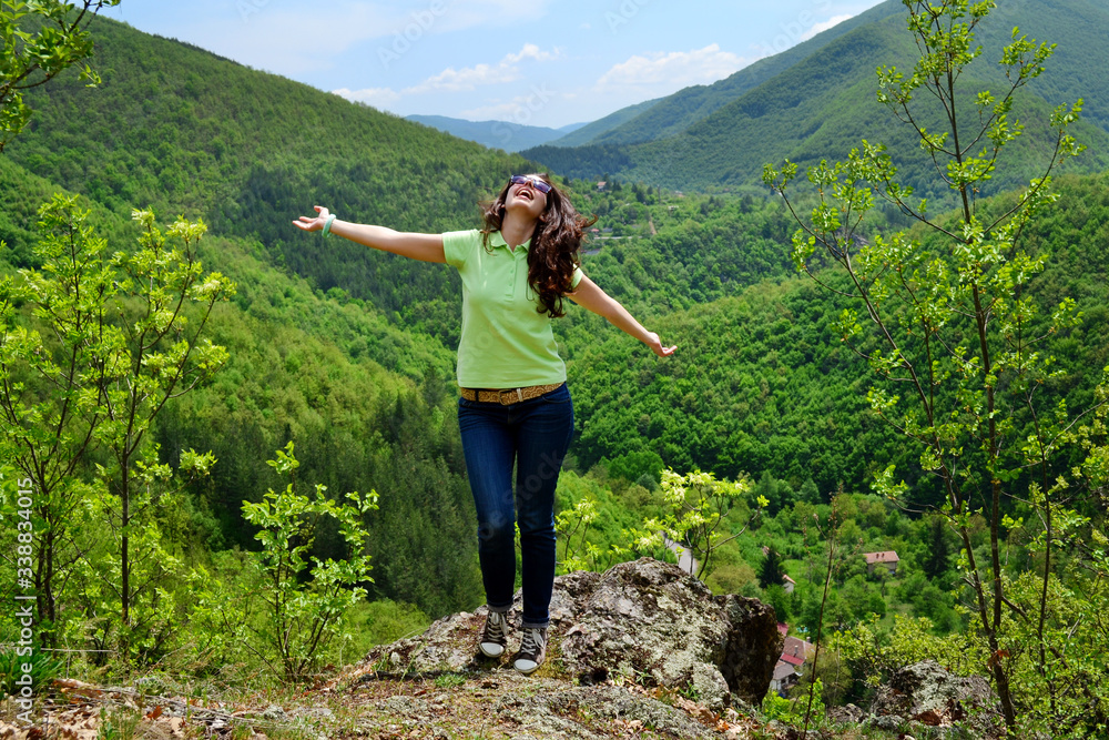 Happy Hiker Woman on the Top of Summer Mountain with Stunning View 