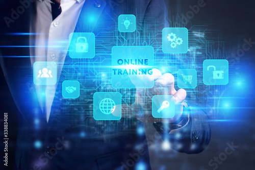 Business, Technology, Internet and network concept. Young businessman working on a virtual screen of the future and sees the inscription: Online training