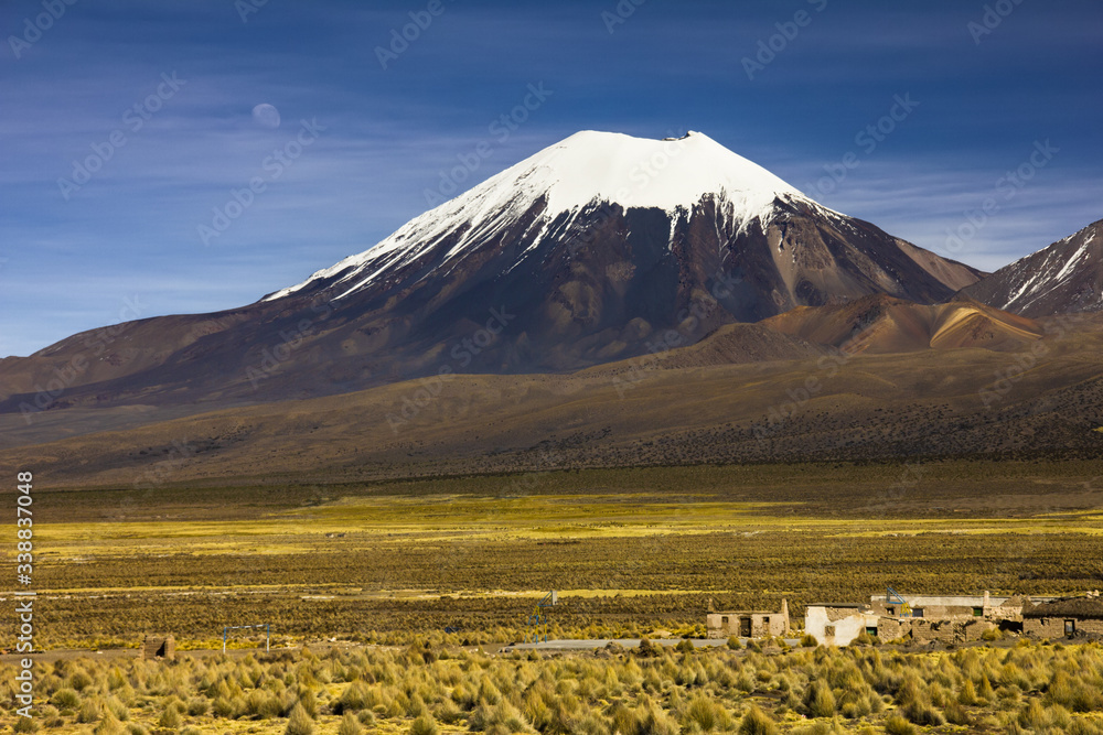 Parinacota volcano and moon - Altiplano in the Central Andes, Bolivia