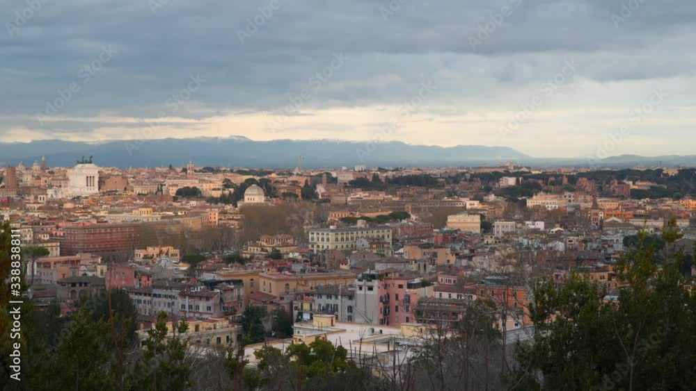 Top view of the historic district of Rome. Evening time. Mountains are visible on the horizon Top view of the historic district of Rome. Evening time. Mountains are visible on the horizon
