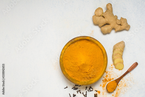 ingredients for Indian traditional Golden milk with turmeric, ginger, spices, honey. healing effect of the drink. antiviral therapeutic antioxidant