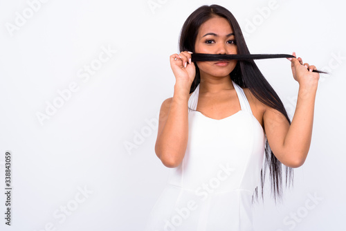 Portrait of young Asian businesswoman with hair as mustache
