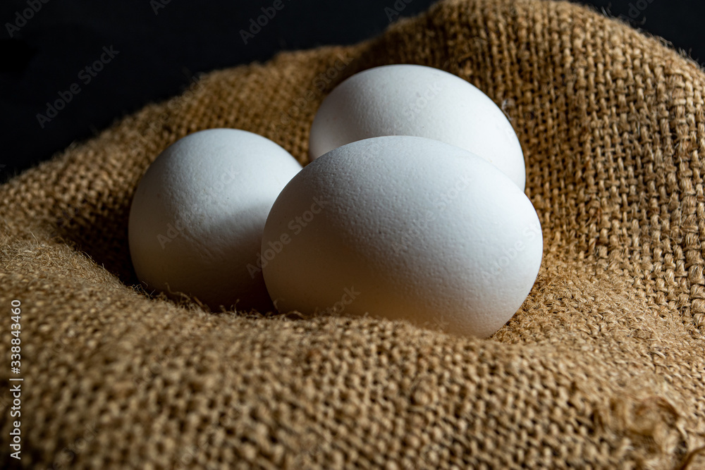 Three egg in sack with black background Three egg in sack with black background
