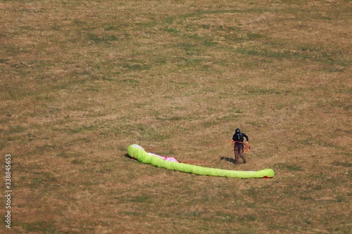 action, activity, adventure, air, background, beak, beautiful, black, blue, cute, extreme, feather, field, flight, fly, freedom, fun, glider, gliding, grass, green, ground handling, high, landscape, l