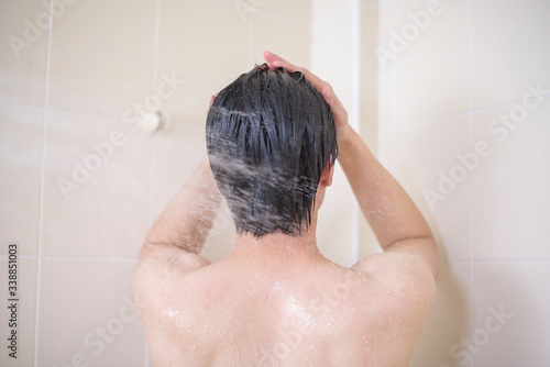 A man is taking a shower