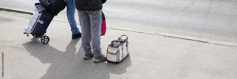 People are standing with luggage, lack transport People are standing with luggage, lack transport