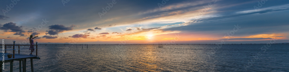 Wide panorama traveler woman joy beautiful nature scenic landscape Songkhla lake at sunset, Panoramic view tourist travel Thailand summer vacation trips, Tourism destinations place Asia for web banner