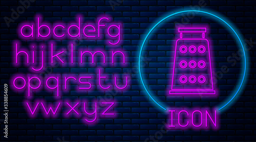 Glowing neon Grater icon isolated on brick wall background. Kitchen symbol. Cooking utensil. Cutlery sign. Neon light alphabet. Vector Illustration