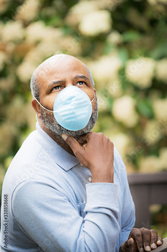 Coronavirus, portrait of African American man outside with protective mask. Concept of Lockdown, Flatten the Curve, Social Distancing, State of Emergency, Corona Virus