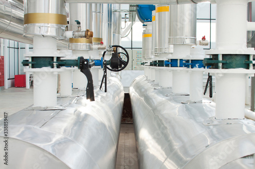 фотографія Water pumps from boilers in an industrial greenhouse