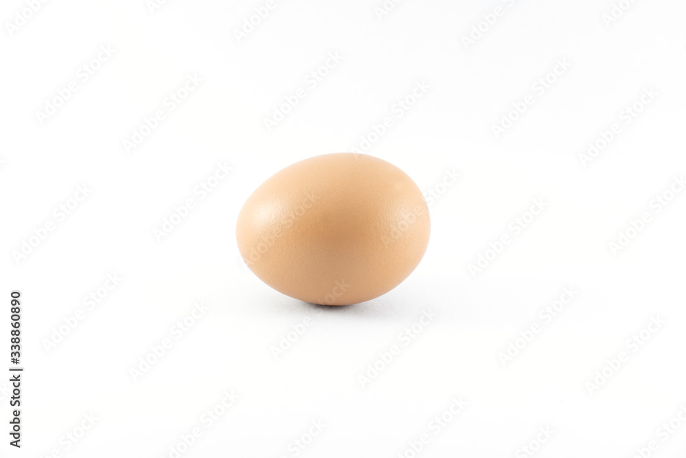 Close up of organic raw brown chicken egg isolated with white background Close up of organic raw brown chicken egg isolated with white background