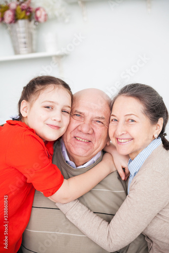 Teen girl with her grandparents.