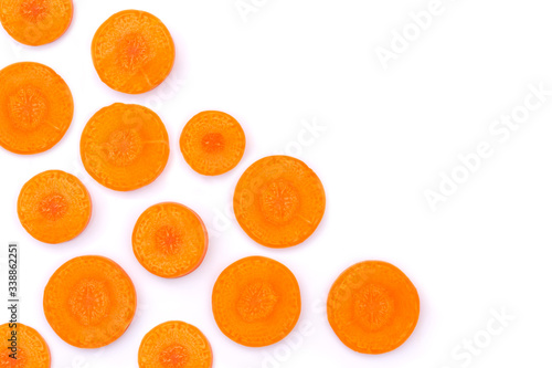 Fresh organic slice of orange carrot isolated on white background. Top view. Flat lay. Copyspace for text.