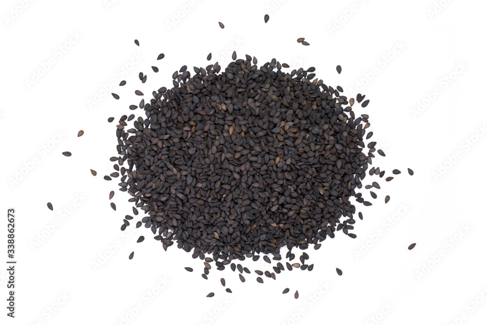 Closeup pile of balck sesame seeds isolated on white background. Top view. Closeup pile of balck sesame seeds isolated on white background. Top view.