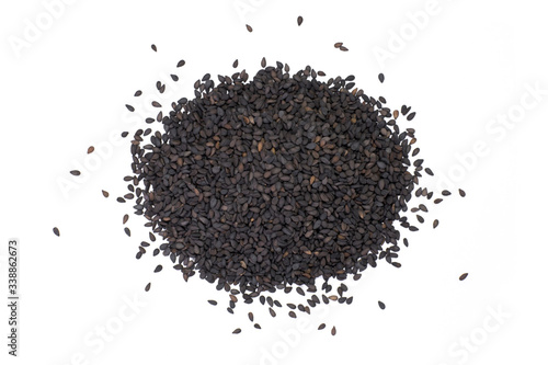 Closeup pile of balck sesame seeds isolated on white background. Top view.