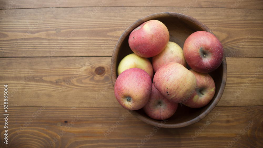 ripe apples on a wooden background ripe apples on a wooden background
