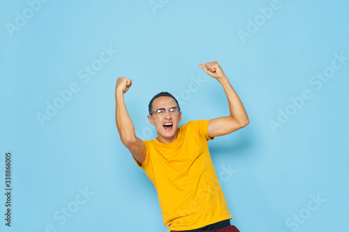 young man with arms raised