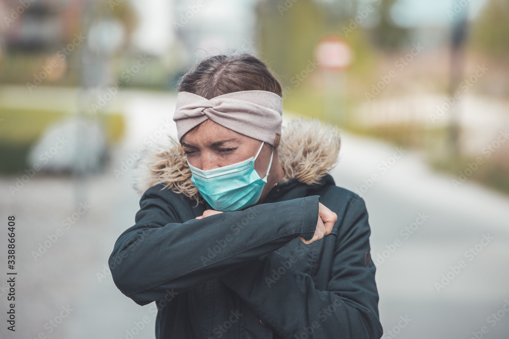 Flue and corona sneezing concept. Woman wearing face mask, sneezing Flue and corona sneezing concept. Woman wearing face mask, sneezing