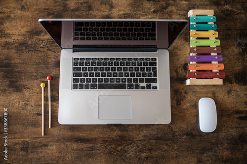 Working home concept. Laptop with children toys. Covid 19. Copy space.
