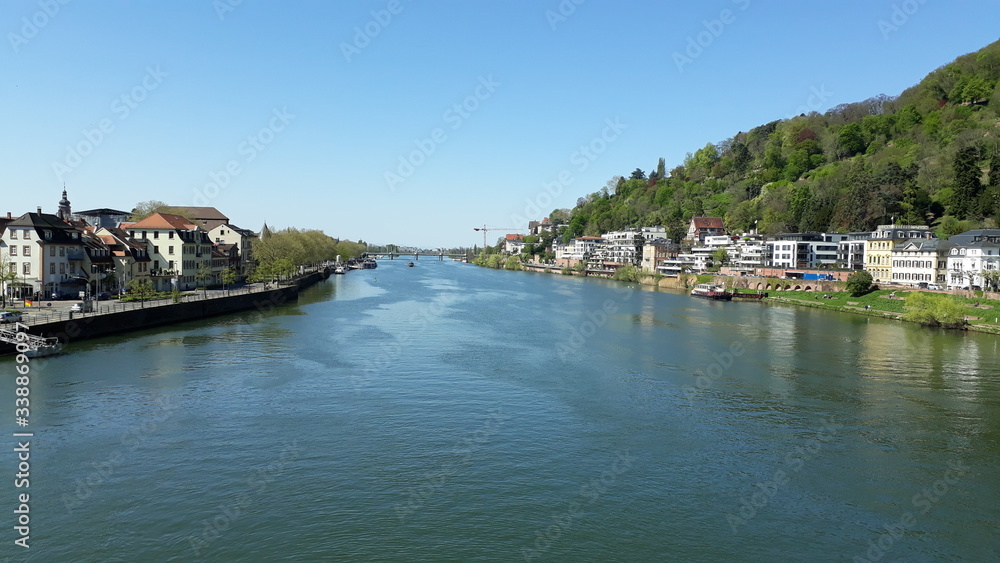 panoramic view of a river crosing a city surrounded by mountains
