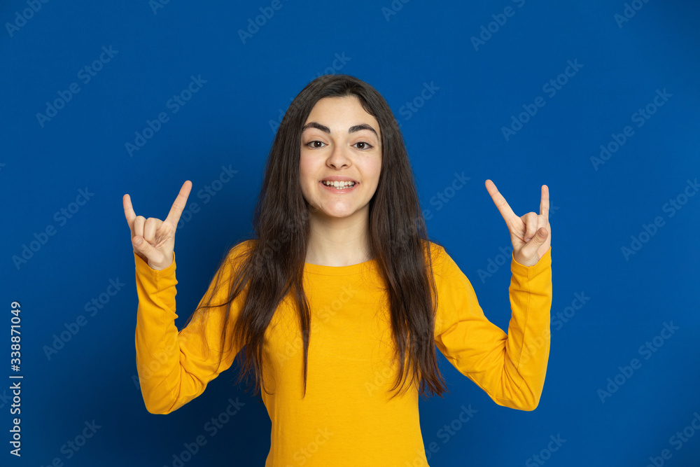 Brunette young girl wearing yellow jersey Brunette young girl wearing yellow jersey