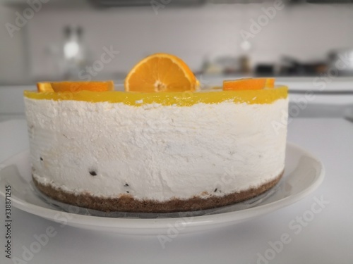 A detail of An orange cheesecake