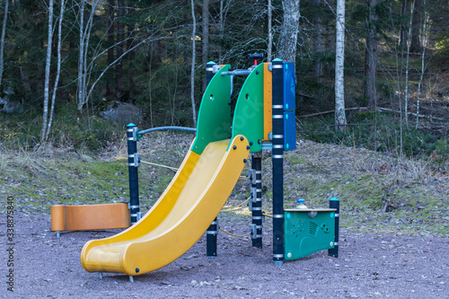 Slide on the empty playground in February, Finland