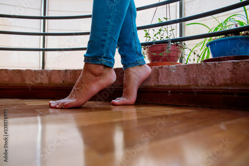 barefoot in wooden floor with plants