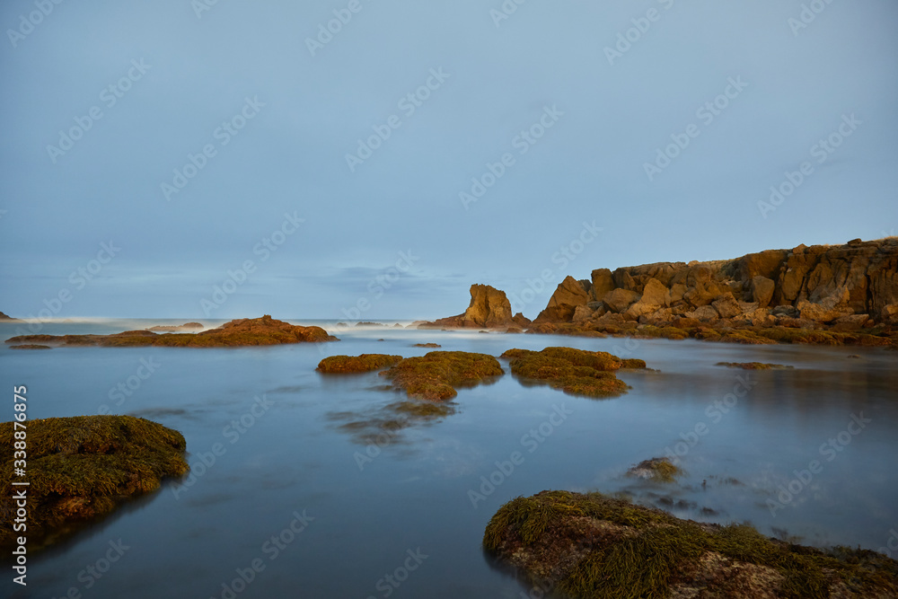 Landscape of rocks and cliffs in nature in the town of Noja made at night at low tide, Cantabria, Spain.