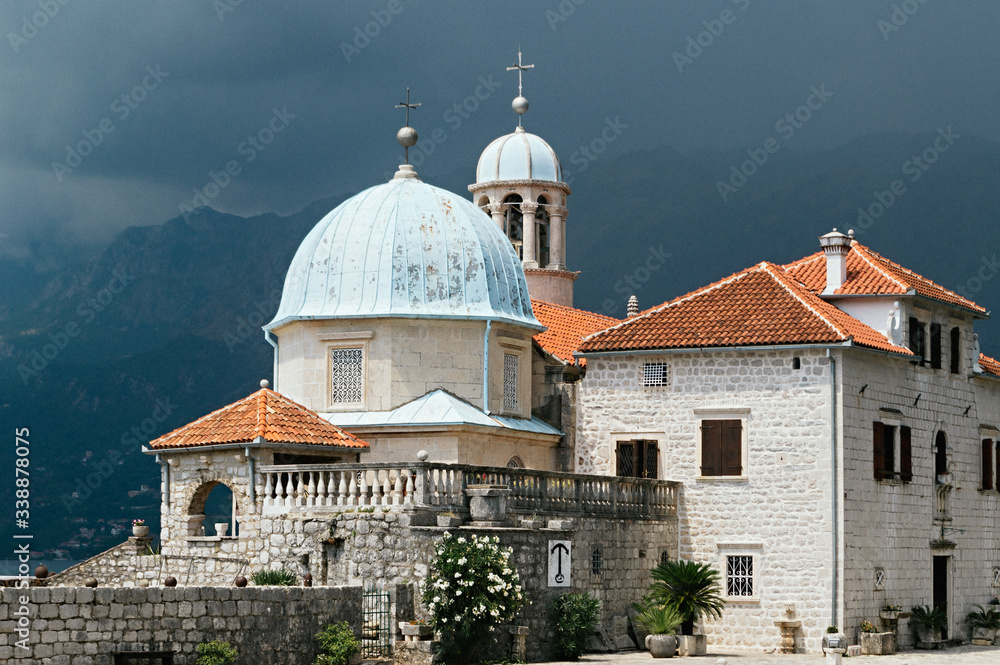 Thunderclouds over Our Lady of the Rock Island near town Perast, a very popular tourist destination, Kotor Bay, Montenegro